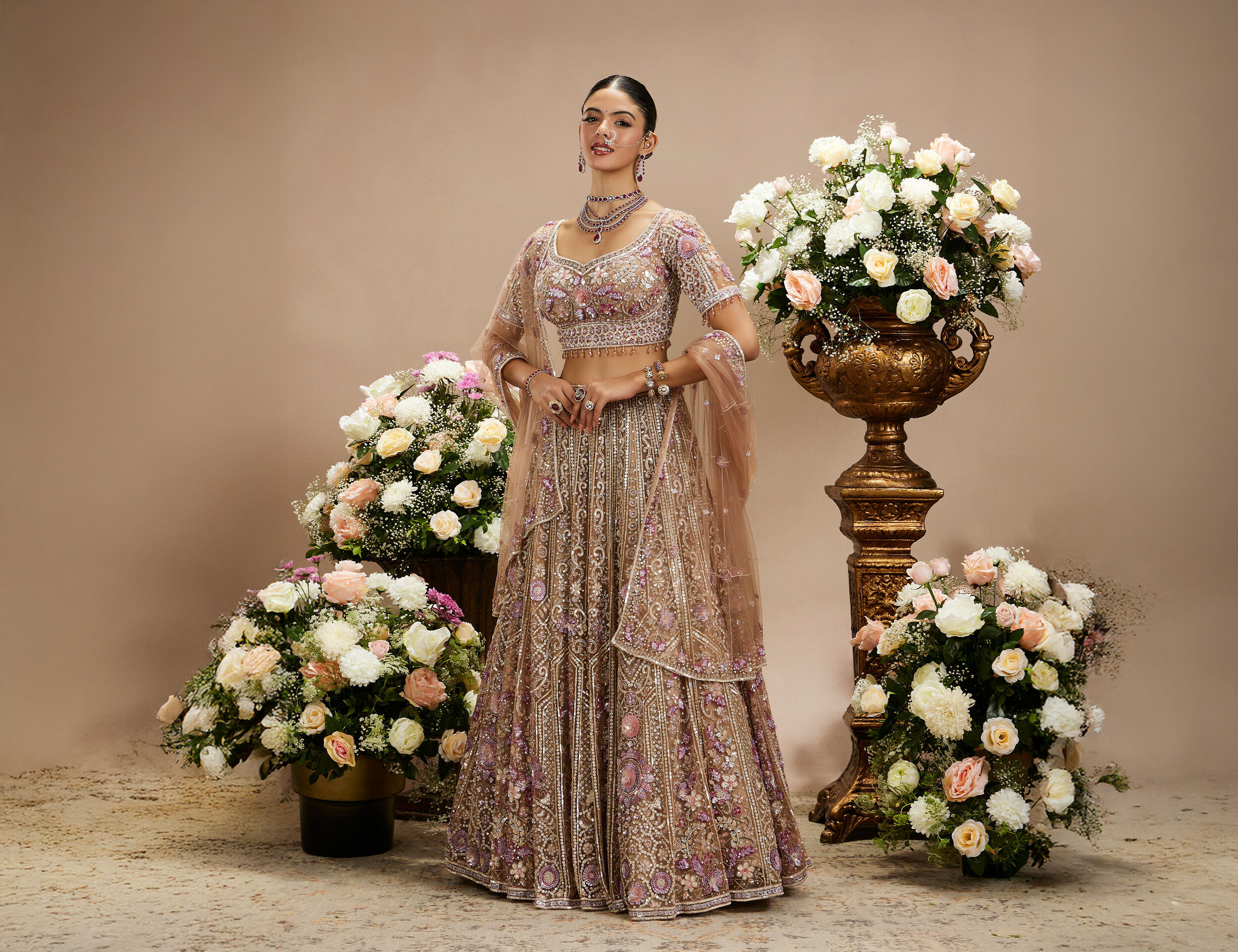 A bride wearing elegant designer pink lehenga for wedding